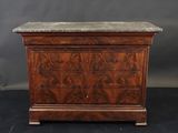 an antique chest of drawers with marble top
