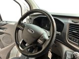 a steering wheel and dashboard of a car in a car