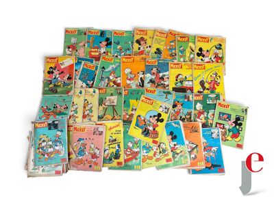 a pile of mickey mouse books on a white surface