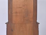 a small wooden cabinet with a drawer on top of it