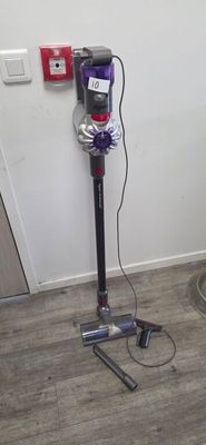 a vacuum that is sitting on the floor in the room