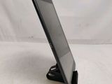 a tablet that is sitting on a stand on the table