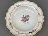 a white plate with a floral design on it