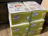 four boxes of durobex baby diapers stacked on top of each other