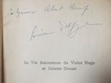 an old book with a handwritten title and signature on it