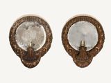 pair of antique wall sconces with mirrors on each of them