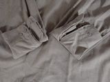 a close up of a pair of pants laying on a bed