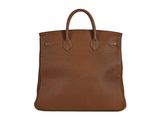 a brown leather tote bag on a white background