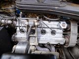 a close up of a car ' s engine with the hood open