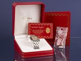 a red box with a silver watch inside of it