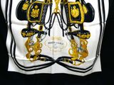a picture of a black and gold purse with gold chains on it