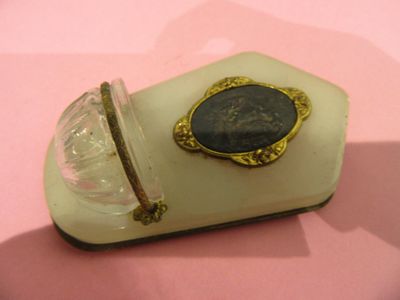 a small glass box with a picture of a man on it
