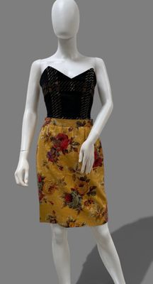 an image of a mannequin dressed in a yellow and black dress