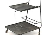 a black trolley with a tray on it on a white background