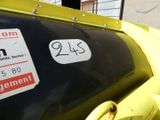 a sign on the side of a yellow truck