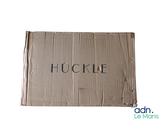 a cardboard box with the word huckle written on it
