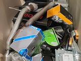 a cardboard box full of electronics and other items
