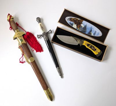 a knife and a box with a picture of a bird on it