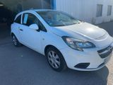 a white car parked in front of a building