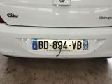 a white car that is parked in a garage