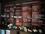 many wine glasses on the shelves in the room