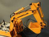 a toy excavator that is sitting on a table