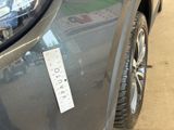 a sticker on the front of a car with a price tag attached to it