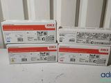 four oki toner cartridges are stacked on top of each other