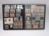 a black folder with stamps on it with pictures of people