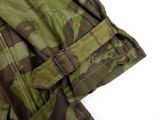 a close up of a military jacket with a belt