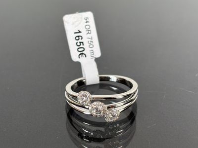 an image of a couple of rings sitting on top of a table