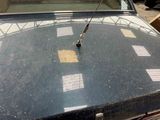 a close up of a car ' s hood with a sticker on it