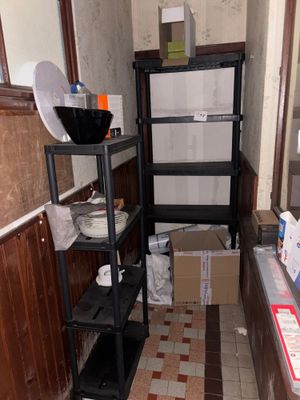 a small kitchen with a lot of items on the shelves