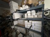 many boxes on the shelves in the room