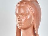 a statue of a woman with a head scarf on