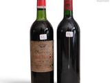 two bottles of wine sitting next to each other on a table