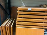 several pieces of wood are stacked on top of each other in a warehouse