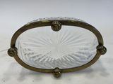 an image of a glass bowl with a handle on a white surface
