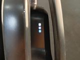 a close up view of a coffee maker with a cup on it