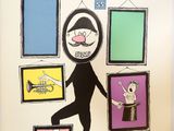 a drawing of a man standing in front of a wall with pictures on it