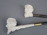 a pipe and a pipe holder sitting on a table