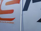 a close up of the side of a truck with a logo on it
