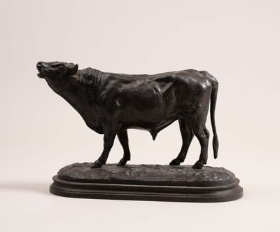 statue of a bull on a pedestal on a white background