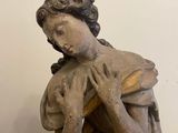a statue of a woman holding a baby in her arms