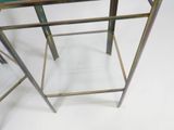a glass table with a metal frame on it