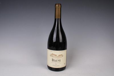 the bottle of red wine is sitting on the table