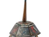 an old wooden incense holder with a wooden stick sticking out of it