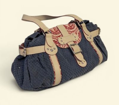 denim and leather handbag with a red and white design