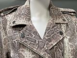 an image of a mannequin wearing a snake skin trench coat