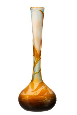 a glass vase that has a brown and white design on it